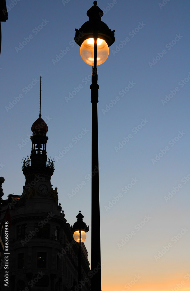 Streetlights in line you light up at sunset