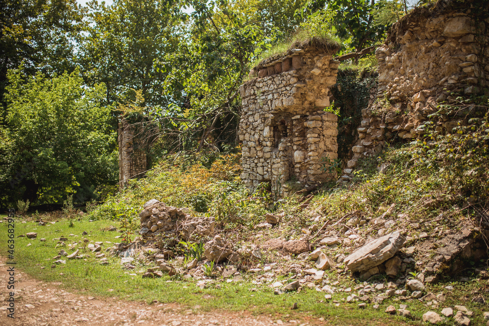 The ruins of an old stone building in the Caucasus mountains - features of the architecture of housing construction in mountain villages