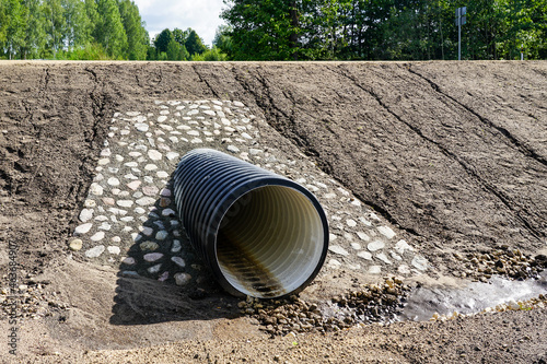 a new modern plastic culvert under the highway