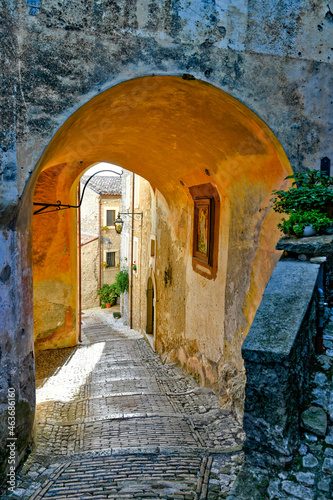 A narrow street of Castro dei Volsci in medieval town of Lazio region, Italy. photo