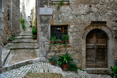 A narrow street of Castro dei Volsci in medieval town of Lazio region, Italy. photo