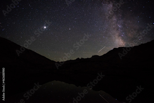Milky way rising over Vogelsang Peak, reflected in Fletcher Lake, Yosemite National Park Tuolumne Meadows photo