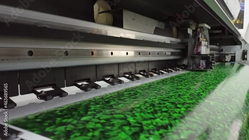 modern printer prints on wide format. Printing photos on printer. Oracal photo printing. Head of printer Mimaki during foto printing process