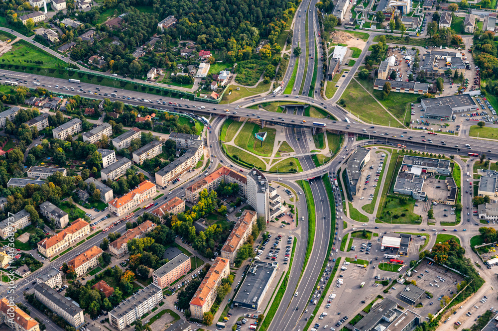 One of a biggest and oldest roundabouts in Vilnius capital of Lithuania. Savanoriu roundabout traffic intersection from the sky