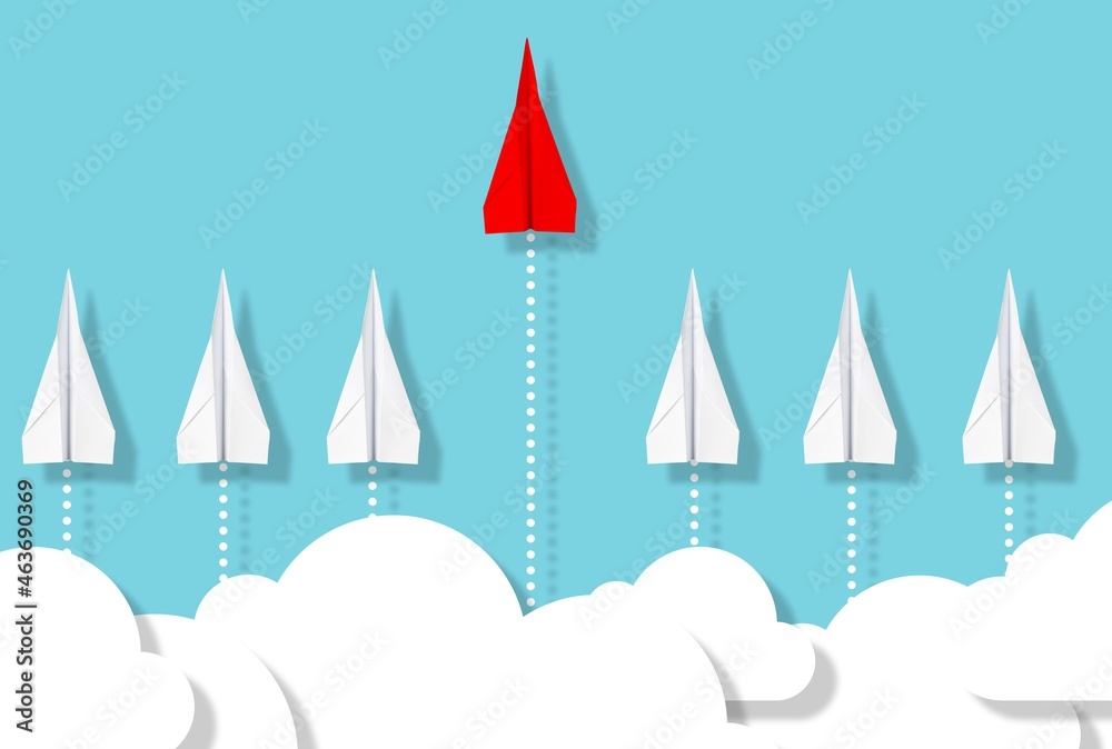 Fototapeta premium Single red paper plane emerges from group of white paper planes on blue background with clouds, business concept for leadership, new ideas, innovation or creativity