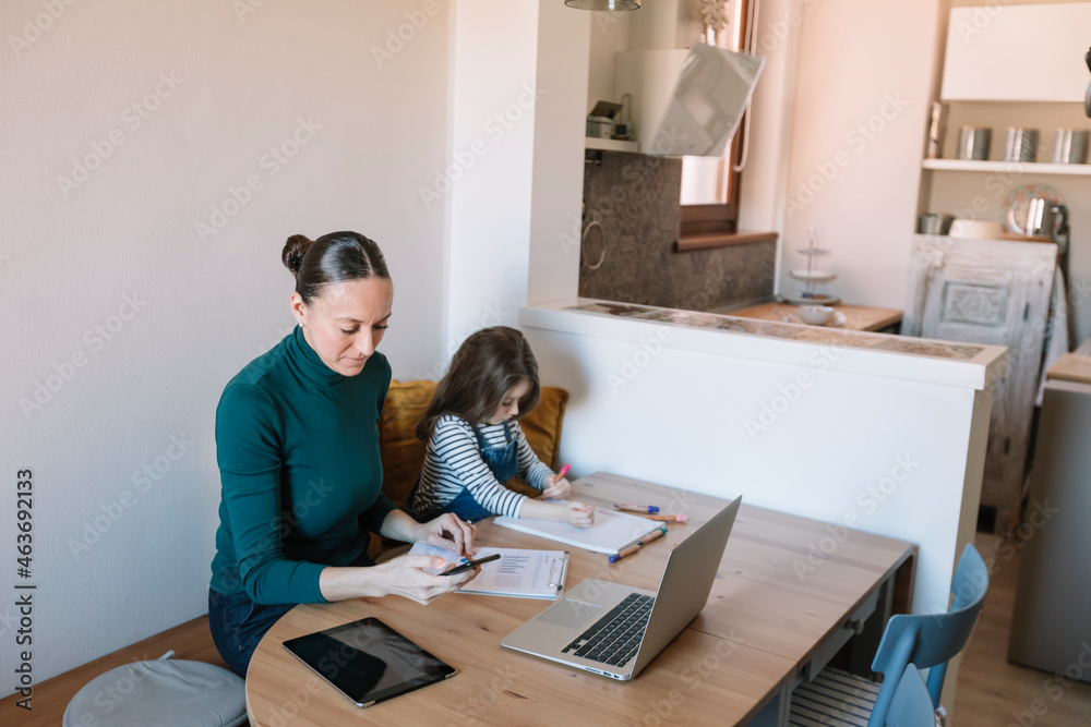 Mother And Child Working And Studying Together At Home Mother And Child Working And Studying Together At Home