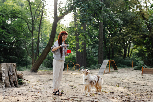 Woman giving water for her pet 