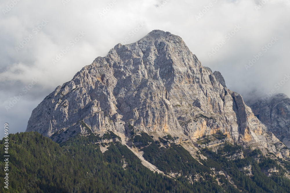 Cima Brenta, the highest mountain in Brenta Dolomites, from Rendena Valley on a cloudy day. Trentino Alto Adige, South Tyrol, Italy. Copy space.