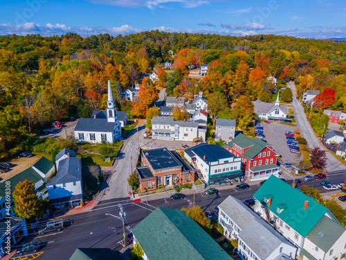 Meredith town center with fall foliage aerial view including First Congregational Church and Mill Falls, New Hampshire NH, USA. 