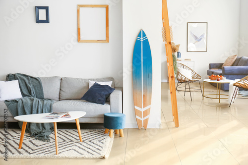Interior of modern room with stylish surfboard