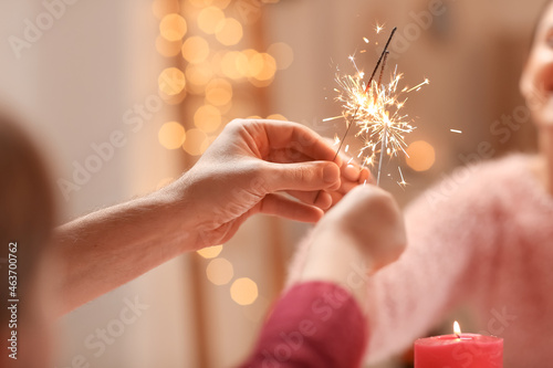 Family with sparklers celeb...