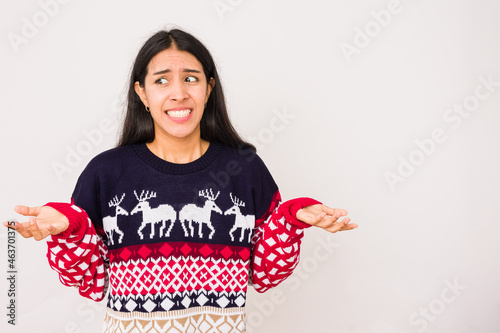 christmas gift become a bad santa idea on a unhappy woman, ugly sweater for christmas celebration