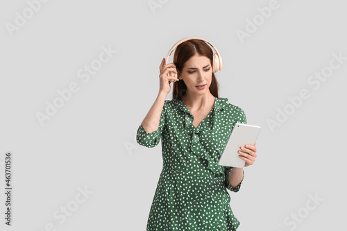 Young woman with tablet com...