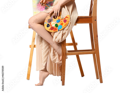 Young female artist on whit...