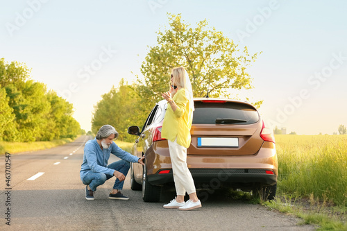 Stressed mature couple near...