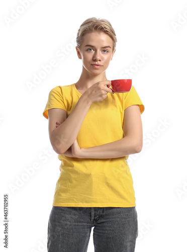 Pretty young woman with cup...