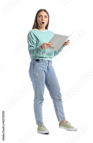 Shocked young woman reading...