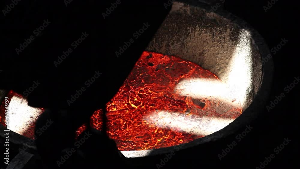 Molten metal in a huge ladle for steel making. Smelting iron at a metallurgical plant. Ferrous metallurgy. 