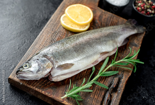 raw trout on a stone background