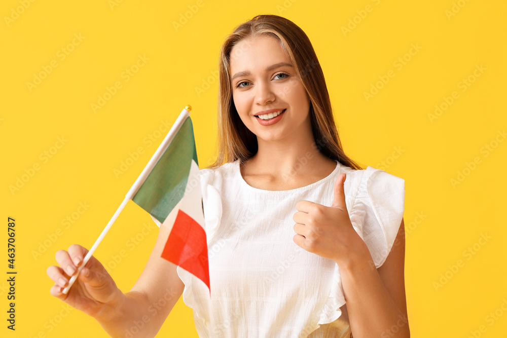 Happy young woman with flag of Mexico showing thumb-up gesture on color background Happy young woman with flag of Mexico showing thumb-up gesture on color background