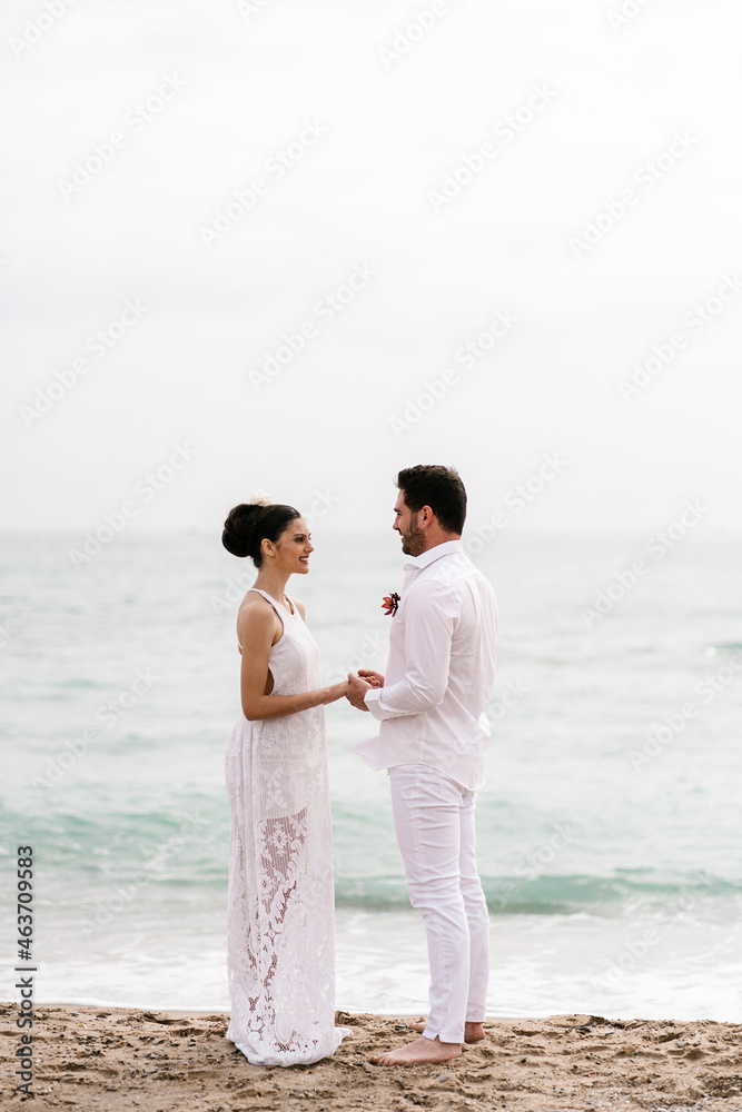 Romantic newlywed couple on seashore Romantic newlywed couple on seashore