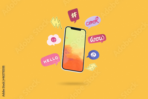 Smartphone and Message bubbles chat papper on yellow background photo