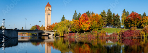 Panorama of Spokane River Reflecting a Colorful Riverfront Park during Autumn in Downtown Spokane, WA