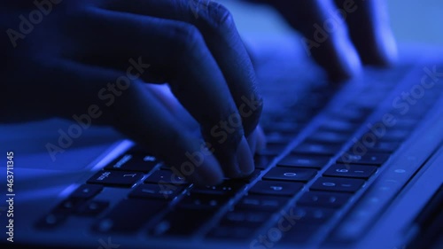 Hands typing on a keyboard