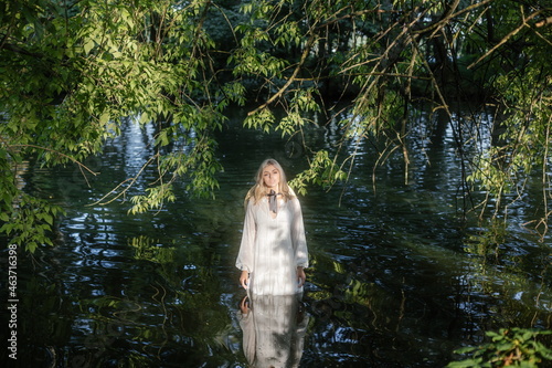 portrait of a girl by a pond