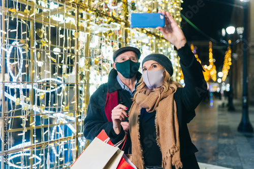 Farther and daughter taking selfie during Christmas photo