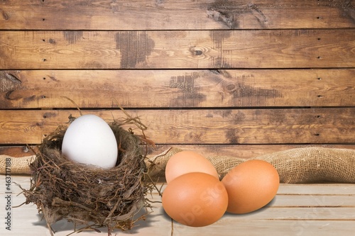 Set of chicken eggs on a wooden table over the farm in the countryside