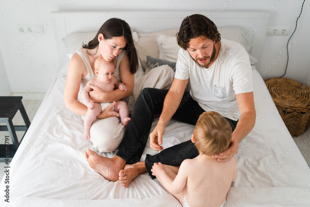 Family spending time together in bed