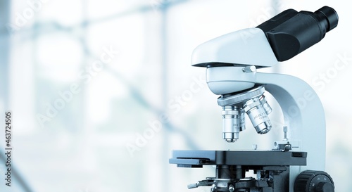 Scientific microscope lenses on medical background