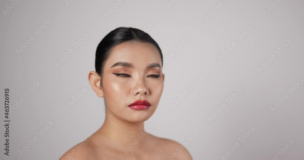 Close up of Attractive Asian woman face looking at camera