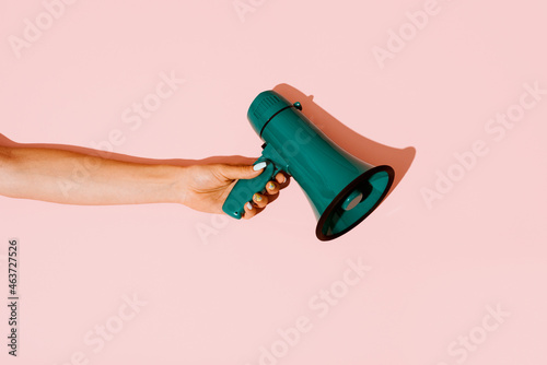 woman has a green megaphone photo