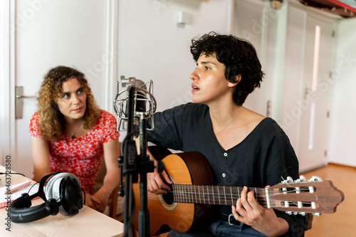 Musician Friends recording music at home studio photo