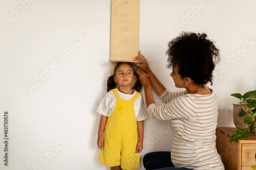 Measurements of a kid's height on the wall photo