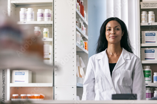 RX: Cheerful Pharmacist Looks At Camera photo