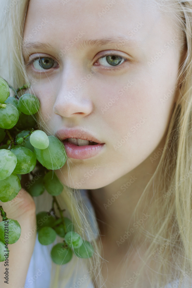 Teenage girl with brunch of grape Teenage girl with brunch of grape