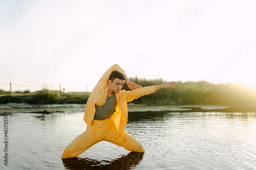 Artist dancing on lake during sunset photo