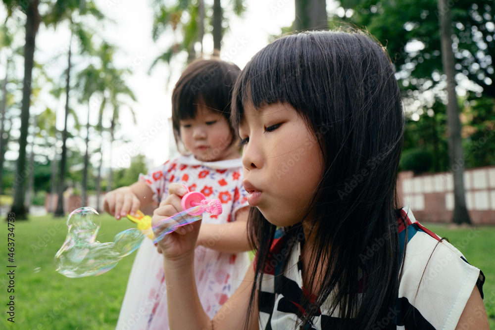 kid playing bubble blowing game kid playing bubble blowing game