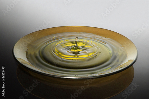 drop falling on water plate