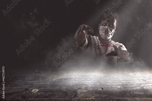 Scary zombie with blood and wound on his body standing