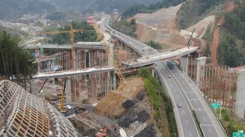 City of Kaili, Guizhou, China. Aerial view of the construction of bridges and highways, city infrastructure of Kaili. photo