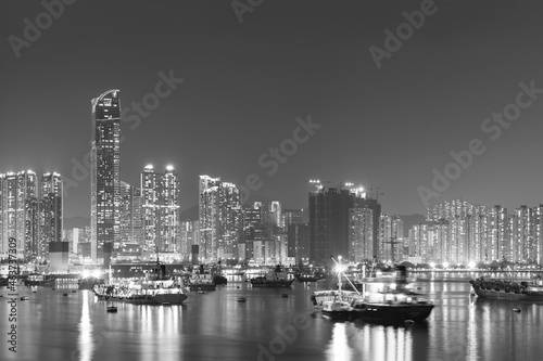 Panorama of harbor of Hong Kong city at night © leeyiutung