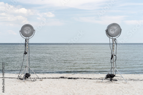 Lighting lamps on light stands at seashore photo