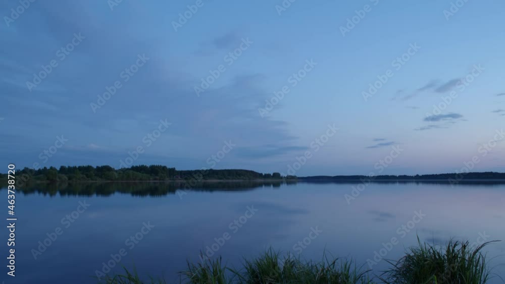 Clouds after sunset, reflected in calm water, time-lapse Clouds after sunset, reflected in calm water, time-lapse