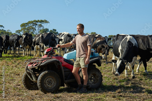 Dairy farmer with his herd