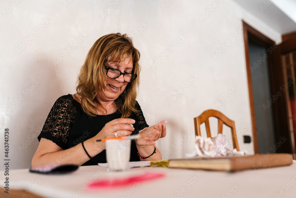 Happy craftswoman working at home Happy craftswoman working at home