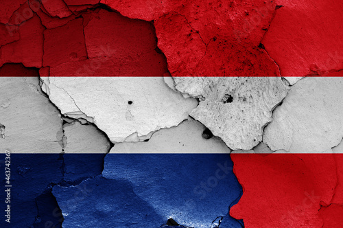 flags of Netherlands and Austria painted on cracked wall